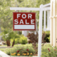 housing market for sale sign outside of home