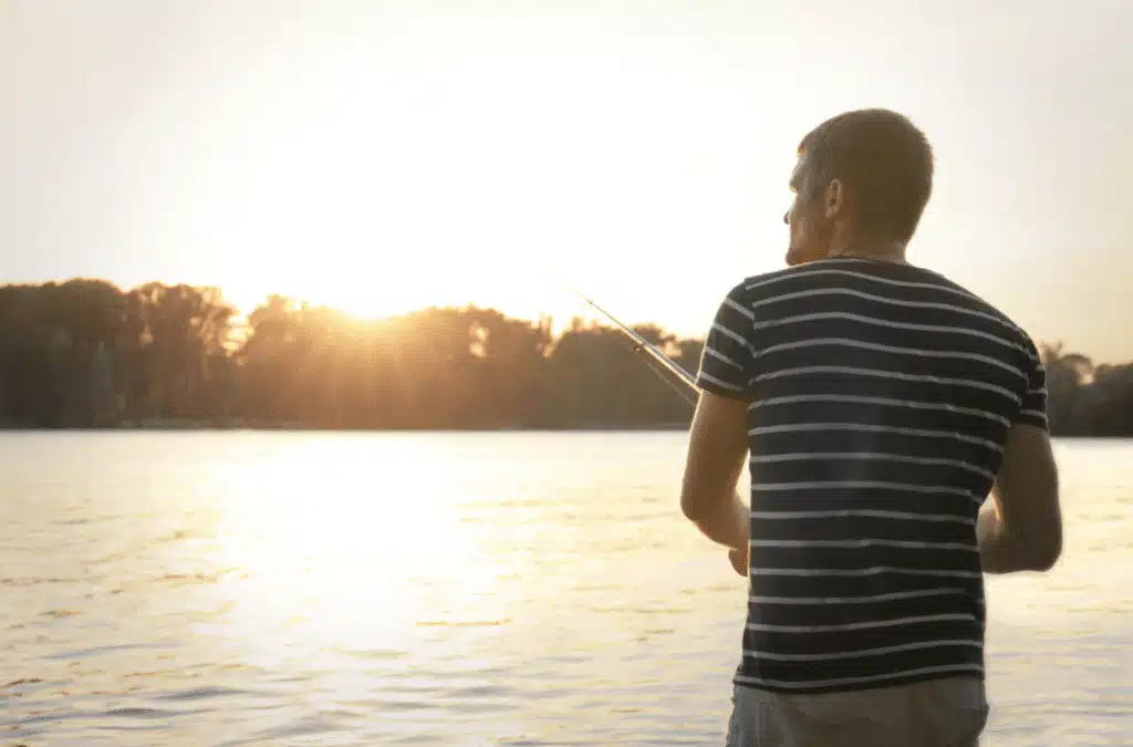 man fishing on lake - The Cloisters of West Tawakoni man fishing on lake