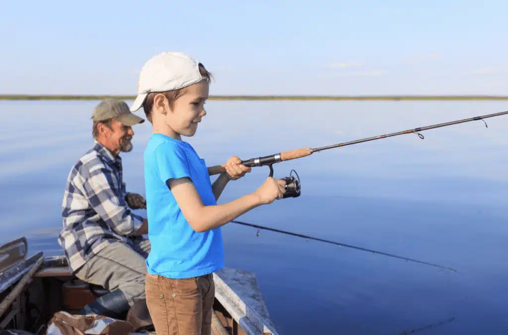 father and son fishing on lake