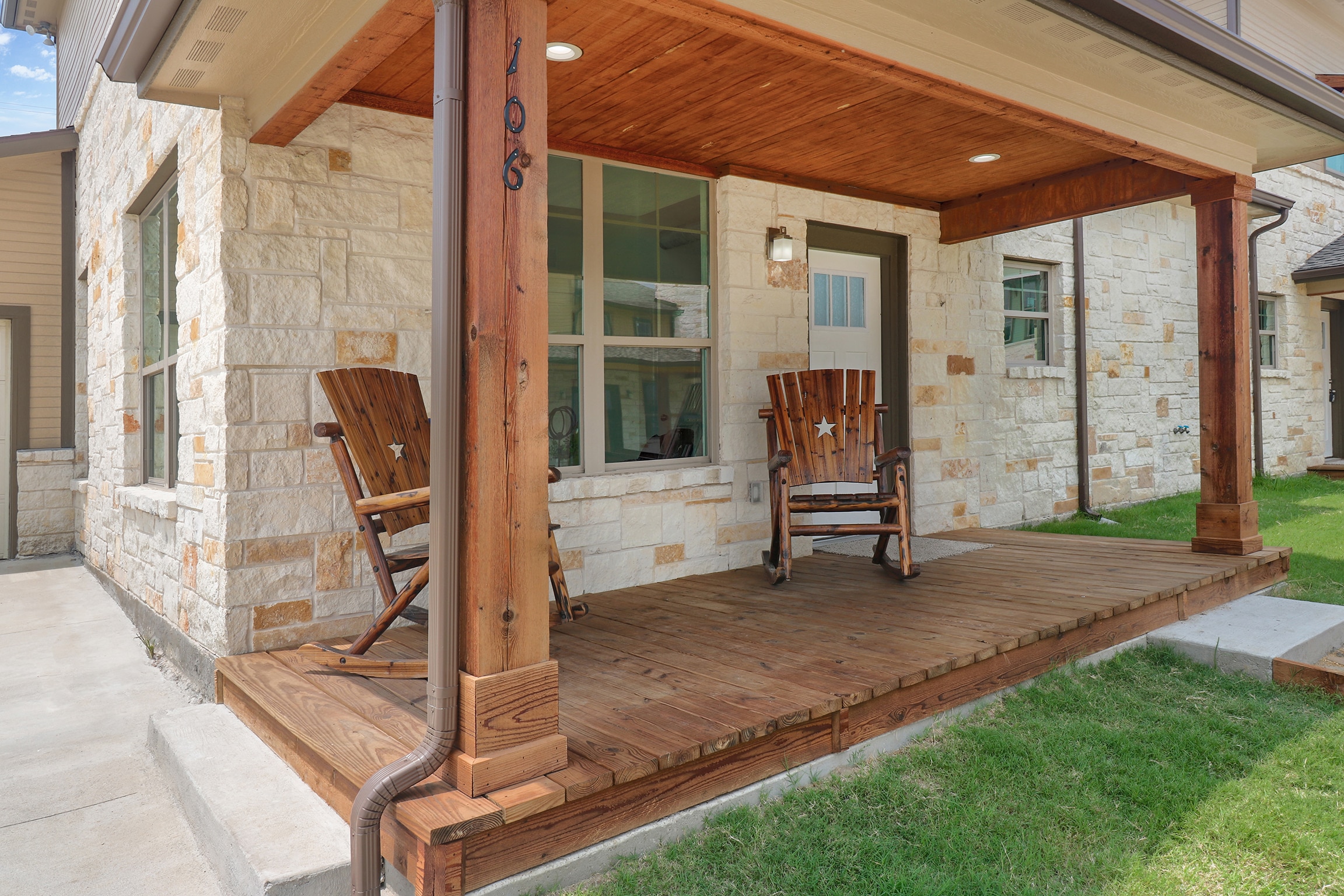 wood front porch with rocking chairs
