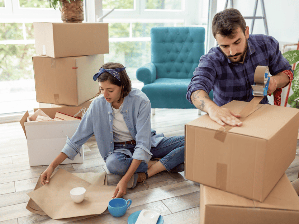 Couple moving house packing things